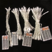Battery-powered LED Christmas string lights with clear battery packs