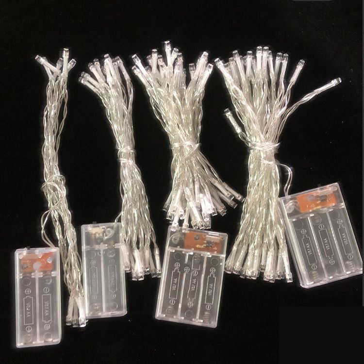 Battery-powered LED Christmas string lights with clear battery packs