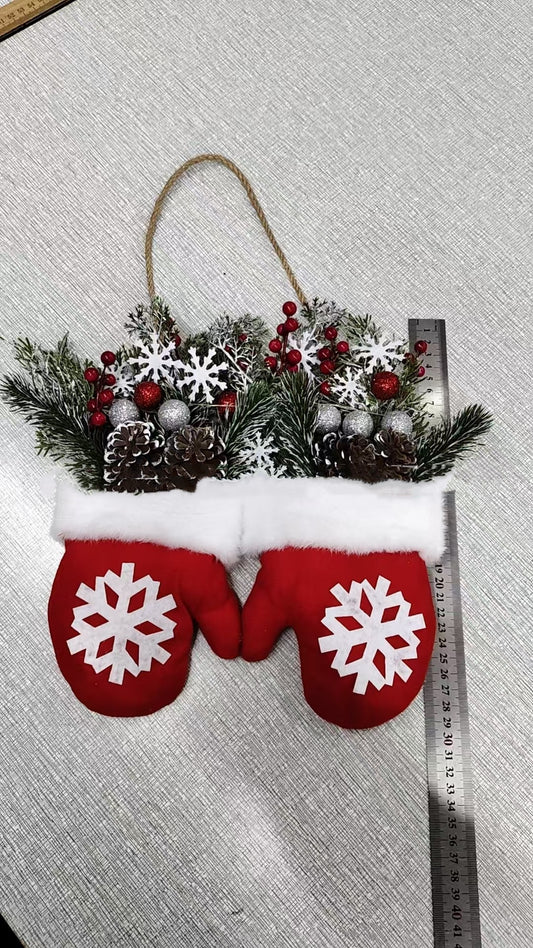 Red Christmas mitten door wreath with greenery pinecones and snowflakes