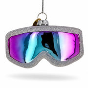 Ski goggle ornament with an iridescent purple and blue lens and a silver frame.
